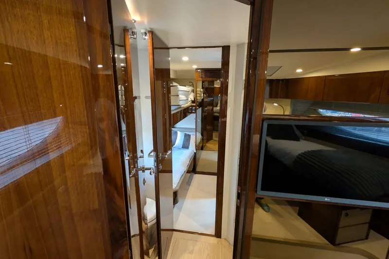 Tender Garage & Hi/lo Swimplatform Yacht Photos Pics Luxurious interior of 2022 Fairline Targa 45 GT yacht, featuring wood finishes and modern amenities.
