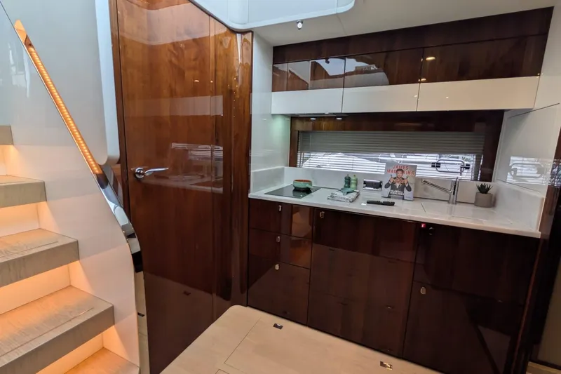 Tender Garage & Hi/lo Swimplatform Yacht Photos Pics Luxurious interior of 2022 Fairline Targa 45 GT yacht with modern kitchen design.