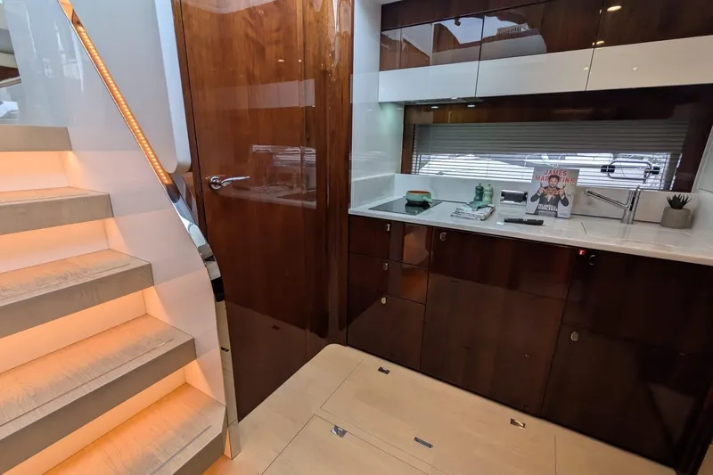 Tender Garage & Hi/lo Swimplatform Yacht Photos Pics Luxurious interior of 2022 Fairline Targa 45 GT yacht with modern kitchen design.