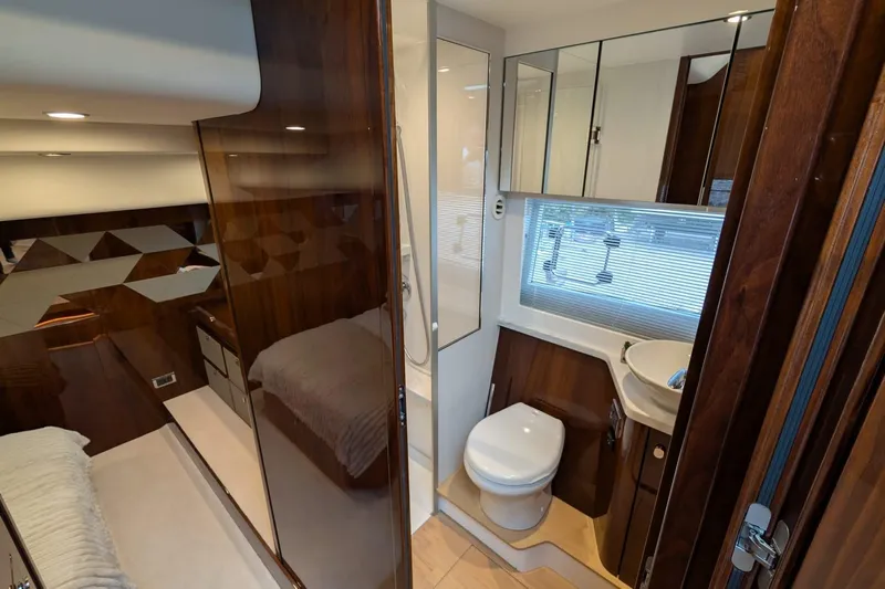 Tender Garage & Hi/lo Swimplatform Yacht Photos Pics Luxurious interior of 2022 Fairline Targa 45 GT yacht bathroom and cabin.