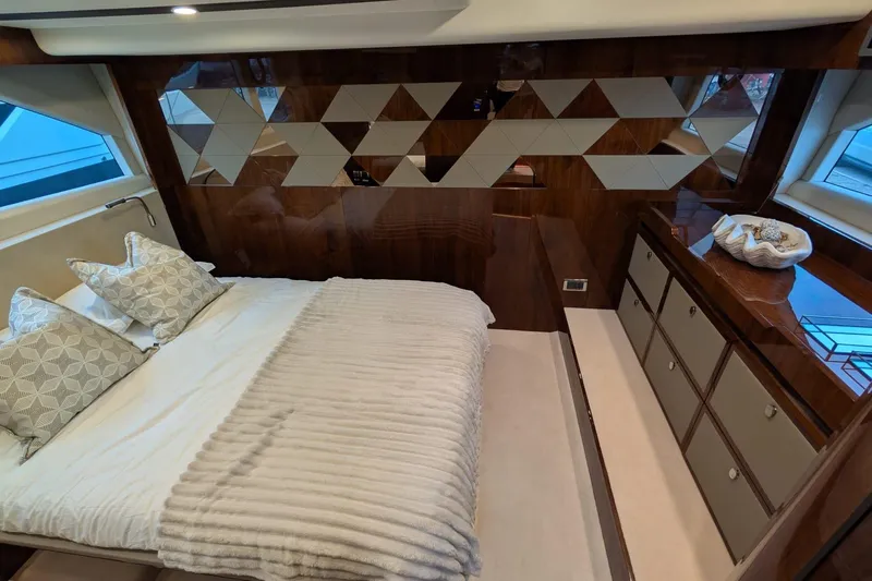 Tender Garage & Hi/lo Swimplatform Yacht Photos Pics Luxurious bedroom interior of 2022 Fairline Targa 45 GT yacht with modern design elements.