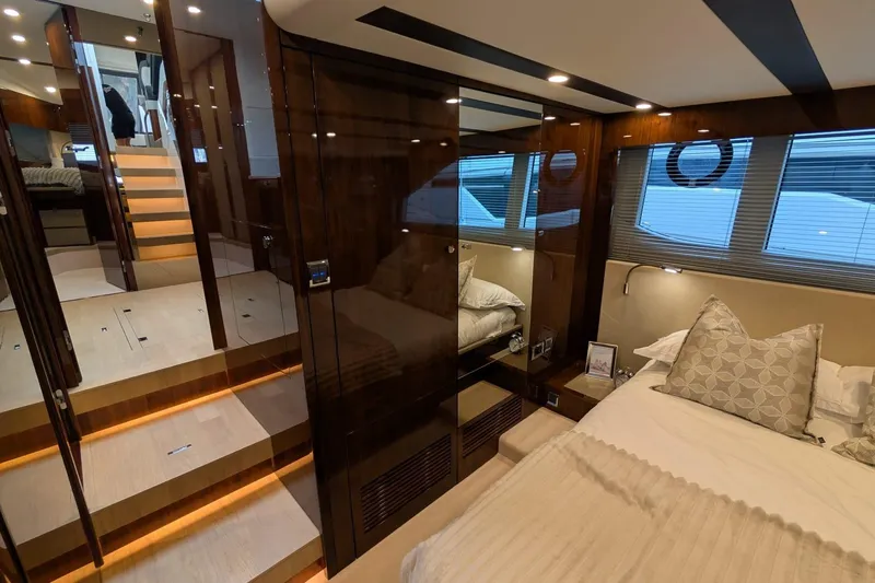 Tender Garage & Hi/lo Swimplatform Yacht Photos Pics Luxurious interior of 2022 Fairline Targa 45 GT yacht bedroom with modern design.