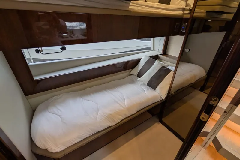 Tender Garage & Hi/lo Swimplatform Yacht Photos Pics Luxurious cabin interior of 2022 Fairline Targa 45 GT yacht with cozy bedding.