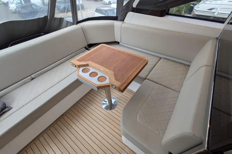 Tender Garage & Hi/lo Swimplatform Yacht Photos Pics Luxurious interior of 2022 Fairline Targa 45 GT yacht with elegant seating and wooden table.