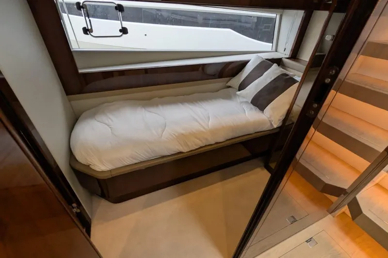 Tender Garage & Hi/lo Swimplatform Yacht Photos Pics Luxurious cabin interior of 2022 Fairline Targa 45 GT yacht with cozy bed.