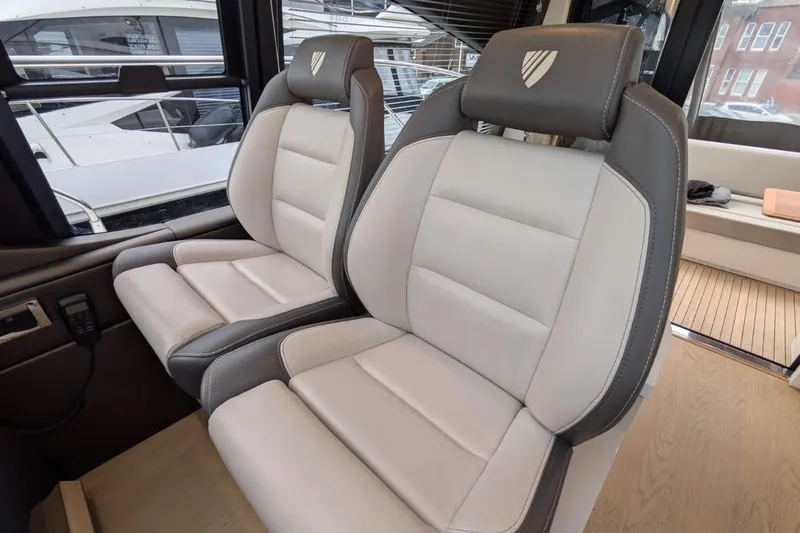 Tender Garage & Hi/lo Swimplatform Yacht Photos Pics Luxury seating inside 2022 Fairline Targa 45 GT yacht, featuring modern design and comfort.