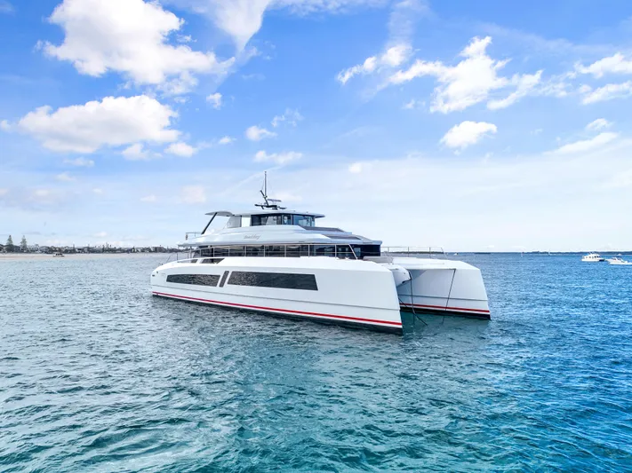 Bundalong Yacht Photos Pics Luxury 2023 McConaghy MC 82P yacht on serene blue ocean under clear sky.