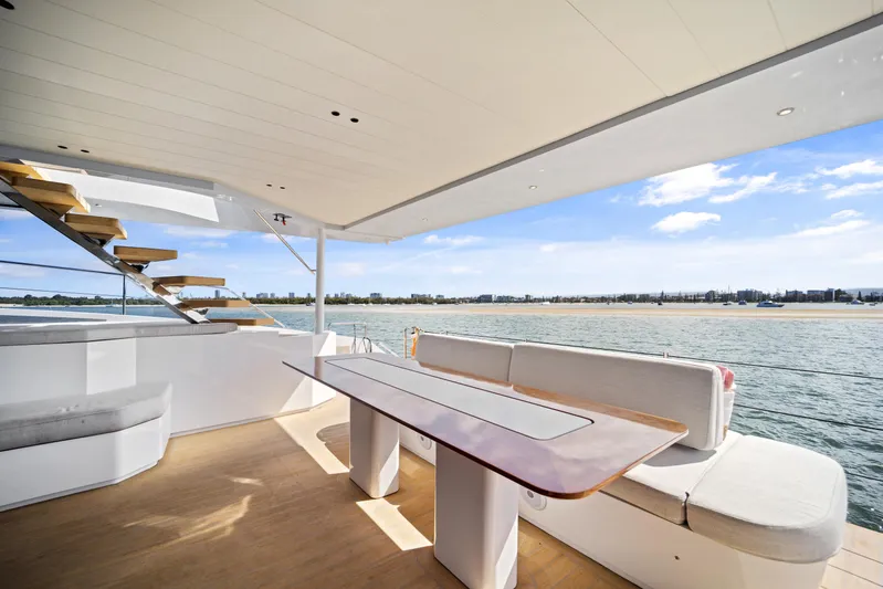 Bundalong Yacht Photos Pics Luxurious 2023 McConaghy MC 82P yacht interior with elegant seating and ocean view.