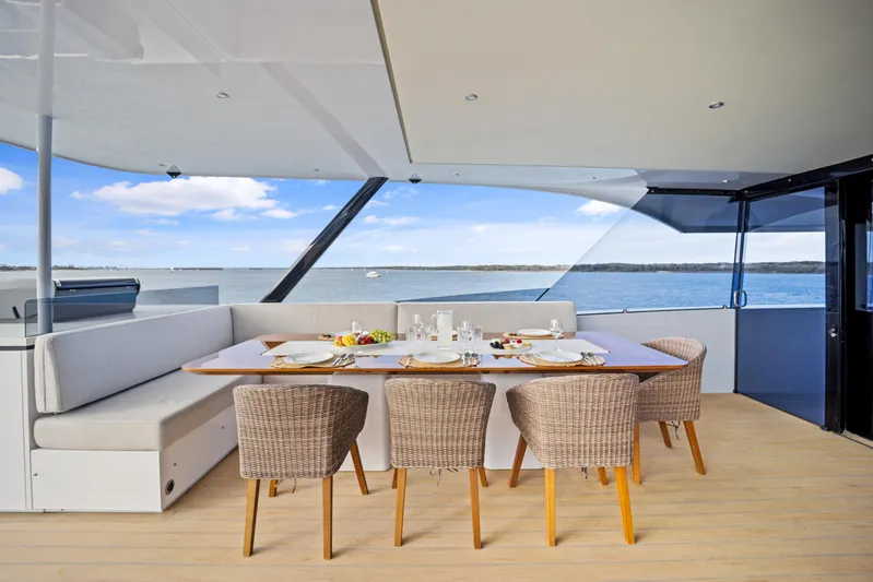 Bundalong Yacht Photos Pics Luxurious dining area on 2023 McConaghy MC 82P yacht with ocean view.