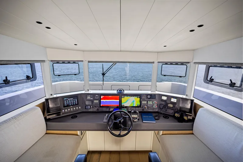 Bundalong Yacht Photos Pics 2023 McConaghy MC 82P yacht helm with advanced navigation systems and panoramic sea view.