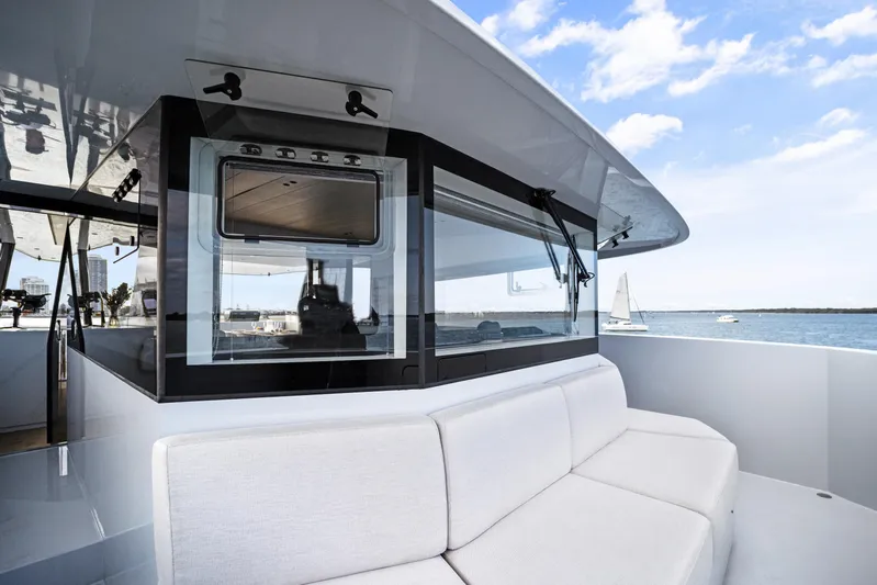 Bundalong Yacht Photos Pics Luxurious McConaghy MC 82P yacht deck with modern seating, ocean view, and sleek design.