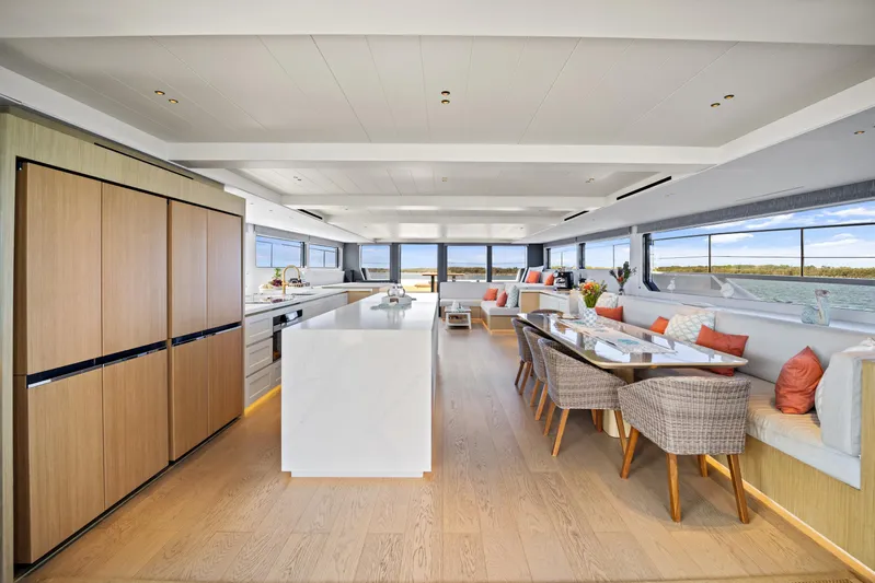Bundalong Yacht Photos Pics Luxurious interior of 2023 McConaghy MC 82P yacht with modern kitchen and dining area.
