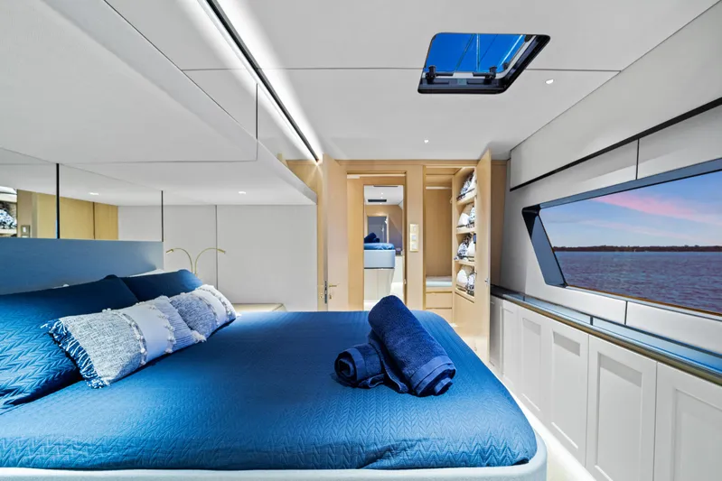 Bundalong Yacht Photos Pics Luxurious interior of 2023 McConaghy MC 82P yacht with ocean view and elegant bedding.