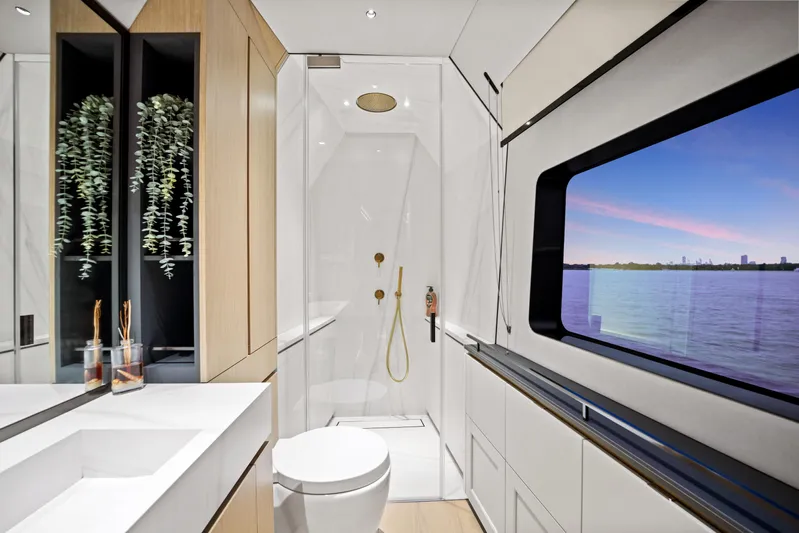 Bundalong Yacht Photos Pics Luxurious bathroom on 2023 McConaghy MC 82P yacht with modern fixtures and scenic window view.
