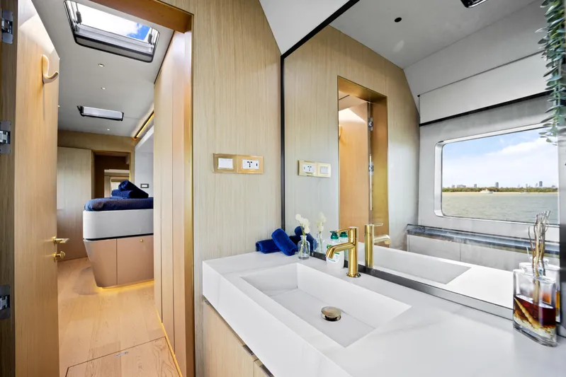 Bundalong Yacht Photos Pics Luxurious 2023 McConaghy MC 82P yacht interior with modern bathroom and scenic window view.