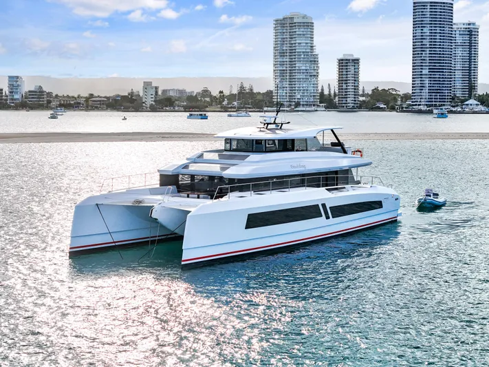 Bundalong Yacht Photos Pics 2023 McConaghy MC 82P luxury yacht on water with city skyline background.