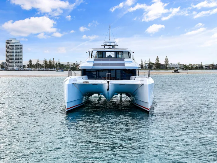 Bundalong Yacht Photos Pics 2023 McConaghy MC 82P catamaran on water, with coastal skyline in background.