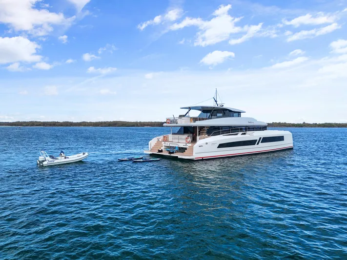 Bundalong Yacht Photos Pics Luxury McConaghy MC 82P yacht on open water, 2023 model, with clear blue sky.