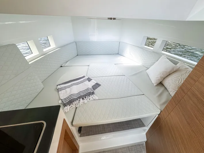  Yacht Photos Pics 2024 De Antonio Yachts D28 Cruiser interior with cozy seating and elegant design.