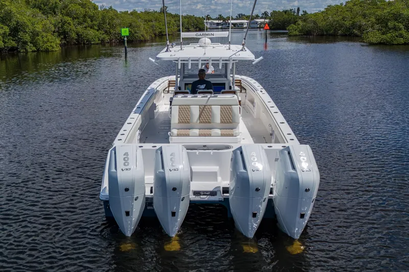 Gotta Go Yacht Photos Pics 2025 Invincible 37 Catamaran with quad 400 V10 engines on a scenic waterway.