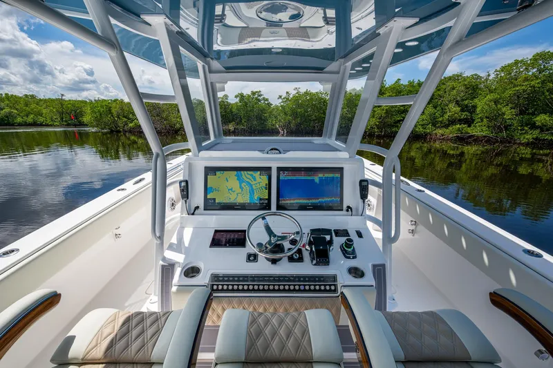 Gotta Go Yacht Photos Pics 2025 Invincible 37 Catamaran helm with advanced navigation systems and luxurious seating.