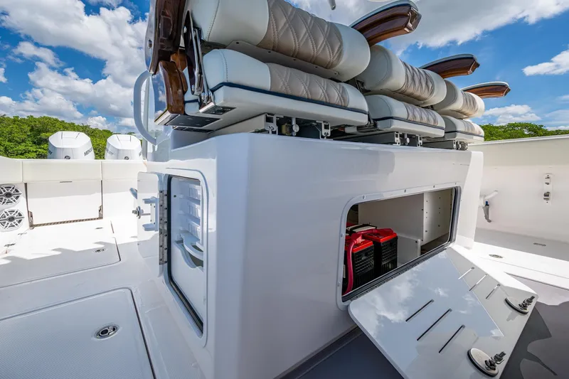 Gotta Go Yacht Photos Pics 2025 Invincible 37 Catamaran interior with storage compartment and seating, under a clear sky.