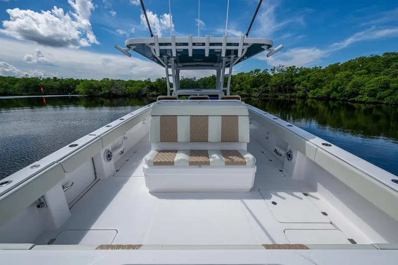 Gotta Go Yacht Photos Pics 2025 Invincible 37 Catamaran with spacious deck, sleek seating, and scenic water backdrop.