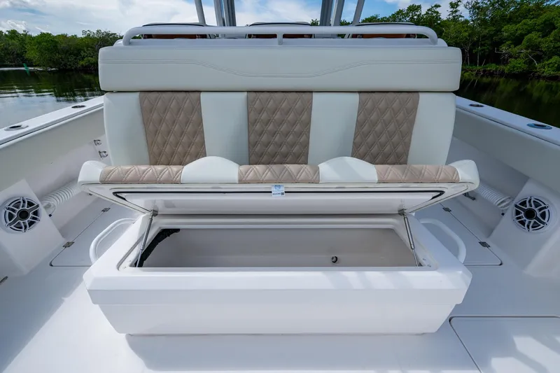 Gotta Go Yacht Photos Pics 2025 Invincible 37 Catamaran with open storage compartment and cushioned seating.