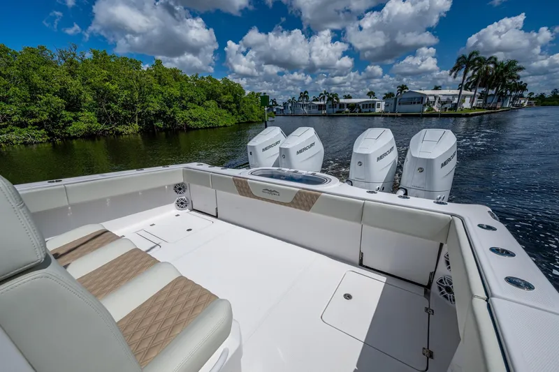 Gotta Go Yacht Photos Pics 2025 Invincible 37 Catamaran with quad engines, cruising on a scenic waterway.