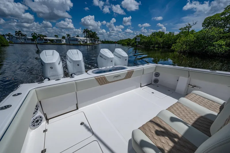 Gotta Go Yacht Photos Pics 2025 Invincible 37 Catamaran with triple Mercury engines on a scenic waterway.
