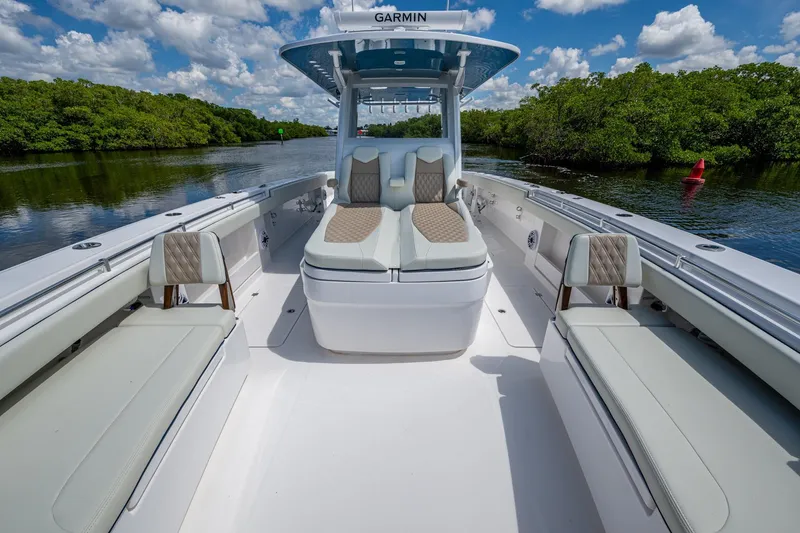 Gotta Go Yacht Photos Pics 2025 Invincible 37 Catamaran with luxurious seating, cruising on a scenic waterway.