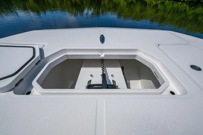 Gotta Go Yacht Photos Pics 2025 Invincible 37 Catamaran anchor locker with chain, on calm water.