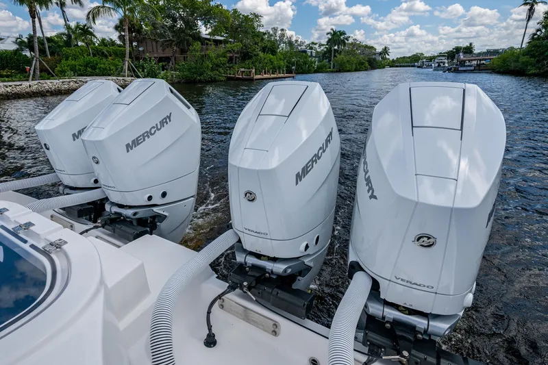 Gotta Go Yacht Photos Pics 2025 Invincible 37 Catamaran with four Mercury outboard engines on a scenic waterway.