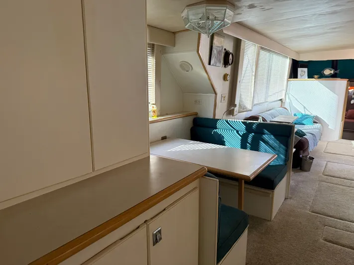 Lexy Lu Yacht Photos Pics Interior of 1996 Bluewater Yachts 52 Limited Edition, featuring dining area and seating.