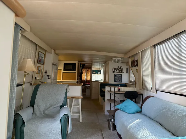 Lexy Lu Yacht Photos Pics Interior of 1996 Bluewater Yachts 52 Limited Edition, featuring cozy seating and natural light.