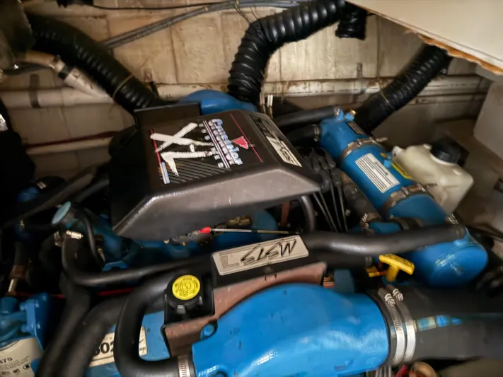 Lexy Lu Yacht Photos Pics Engine compartment of a 1996 Bluewater Yachts 52 Limited Edition, featuring a Crusader engine.