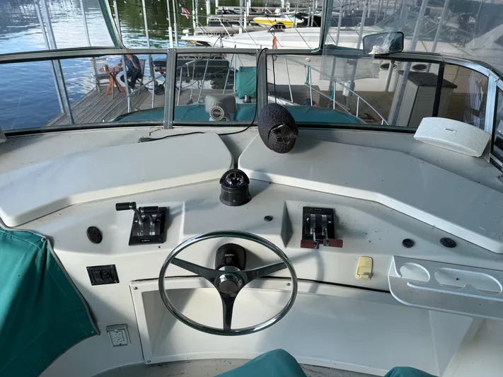 Lexy Lu Yacht Photos Pics Cockpit of 1996 Bluewater Yachts 52 Limited Edition with steering wheel and controls.