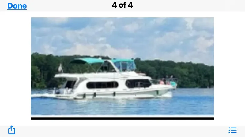 Lexy Lu Yacht Photos Pics 1996 Bluewater Yachts 52 Limited Edition cruising on a serene lake.