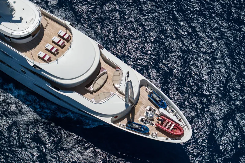 Richar Yacht Photos Pics Luxurious 2008 CRN 185 yacht cruising on deep blue ocean waters.