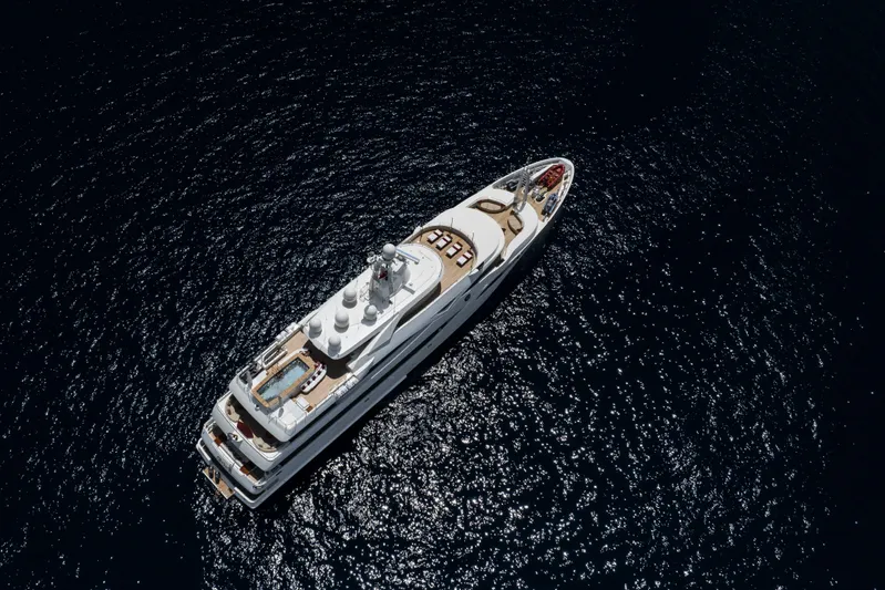 Richar Yacht Photos Pics Aerial view of 2008 CRN 185 yacht on dark blue ocean water.