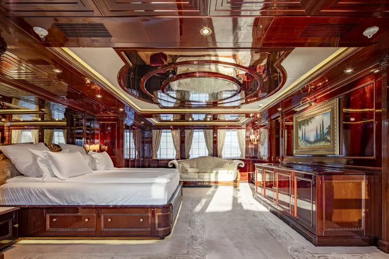 Richar Yacht Photos Pics Luxurious yacht interior with elegant wood paneling, plush bed, and ornate ceiling, CRN 185, 2008.