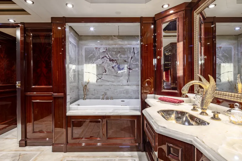 Richar Yacht Photos Pics Luxurious yacht bathroom with marble accents, elegant wood paneling, and gold fixtures, CRN 185, 2008.
