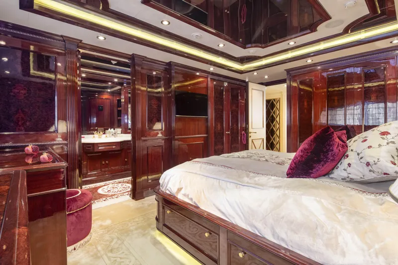 Richar Yacht Photos Pics Luxurious yacht bedroom with elegant wood paneling, plush bedding, and ambient lighting, CRN 185, 2008.