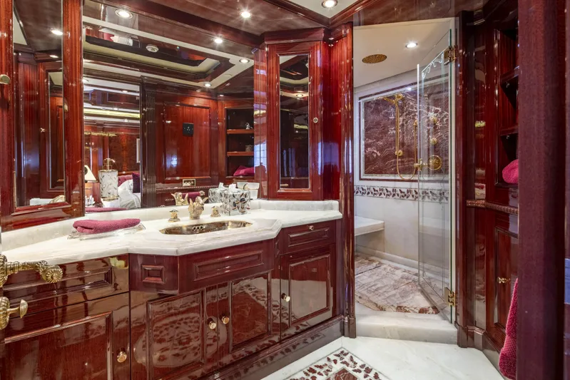 Richar Yacht Photos Pics Luxurious yacht bathroom with rich wood cabinetry, marble countertops, and elegant gold fixtures, CRN 185, 2008.