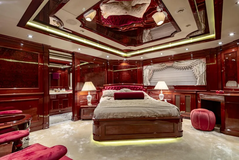 Richar Yacht Photos Pics Luxurious yacht bedroom with elegant wood paneling, plush bedding, and ambient lighting, CRN 185, 2008.