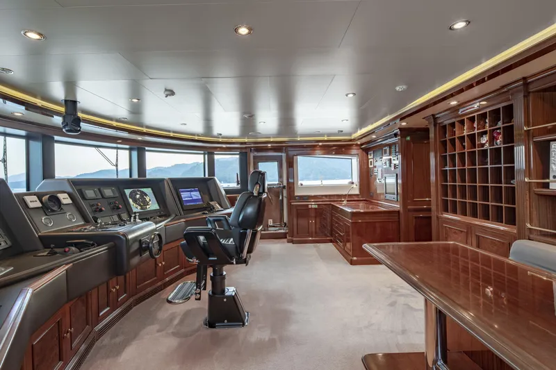 Richar Yacht Photos Pics Luxurious yacht bridge interior with control panels, leather chair, and wooden furnishings, CRN 185, 2008.