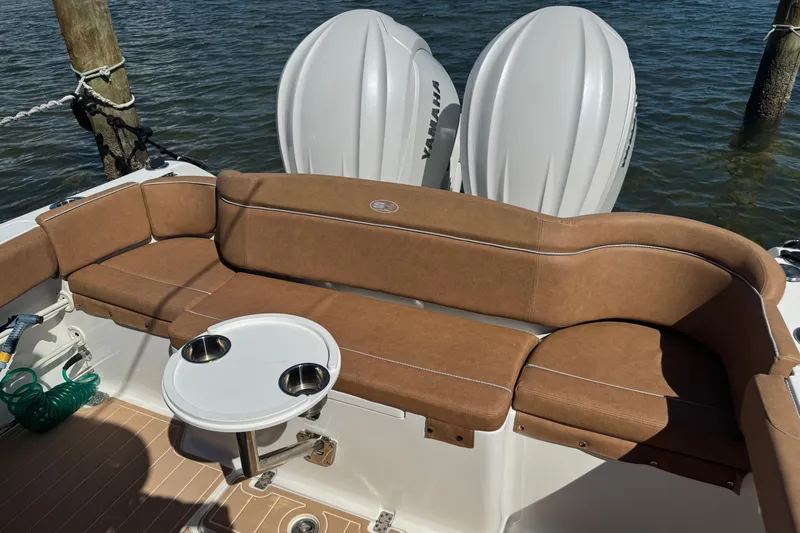  Yacht Photos Pics 2022 Sea Hunt Ultra 305 SE boat with brown seating and dual Yamaha engines.