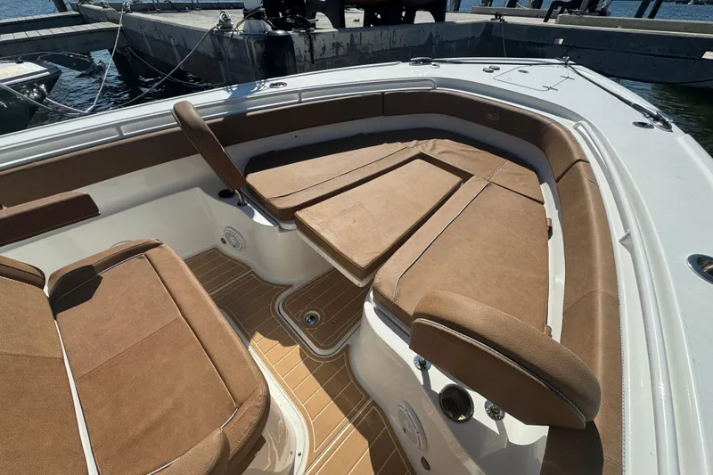  Yacht Photos Pics 2022 Sea Hunt Ultra 305 SE boat interior with brown cushioned seating.