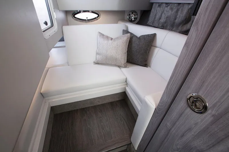 330cbr Yacht Photos Pics Manufacturer Provided Image: 2025 Formula 330 Crossover Bowrider I/O cabin interior with white seating and cushions.