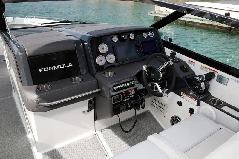 330cbr Yacht Photos Pics Manufacturer Provided Image: 2025 Formula 330 Crossover Bowrider I/O dashboard with modern controls and sleek design.